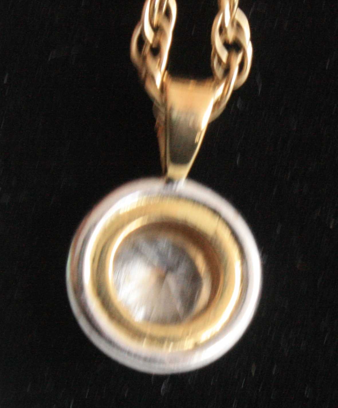 A yellow and white metal diamond single stone pendant, comprising a round brilliant cut diamond in a - Image 3 of 5