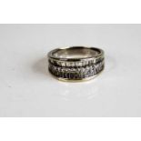 A white metal diamond three-row half hoop eternity ring, featuring a centre row of 15 round