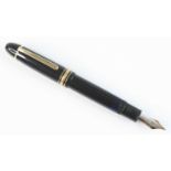 A cased Montblanc Meisterstück 149 fountain pen, black resin with gold-coated trim, the cap with