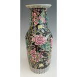 A large circa 1900 Chinese famille noir vase, of slightly shouldered tapering form, the neck with