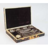 A 19th century tortoiseshell cased sewing box, the four-quarter veneered cover having monogrammed