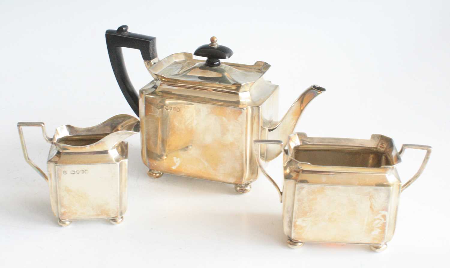 A Victorian silver three-piece bachelor's tea set, comprising teapot, sugar and cream, each piece of