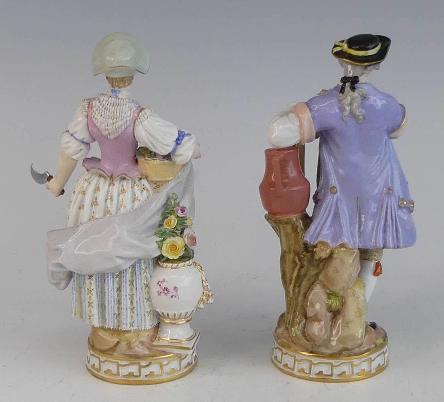 A pair of Meissen porcelain figures of gardeners, late 19th century, each shown in 18th century - Image 2 of 4