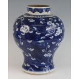 A Chinese blue and white baluster jar, Kangxi period, decorated with prunus and cracked ice,