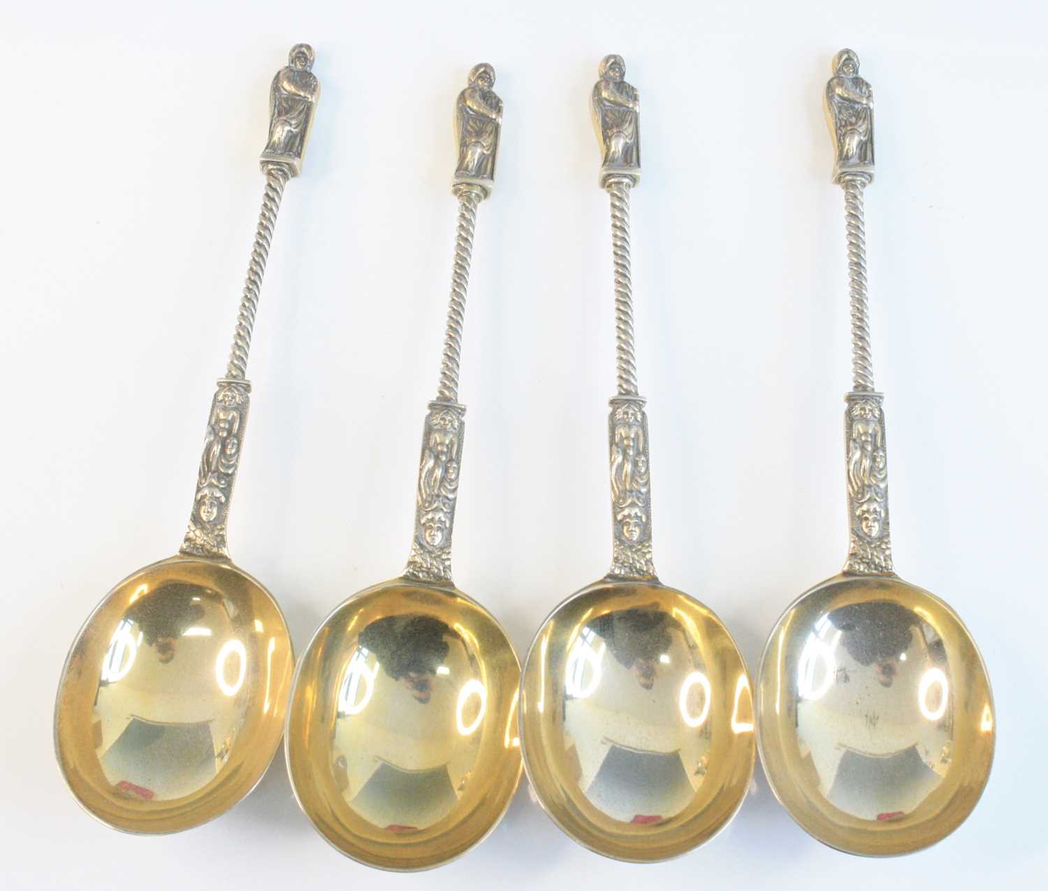 A cased set of four Victorian silver apostle spoons, having Apostle cast terminals upon spiral- - Image 2 of 8