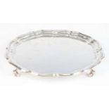 A mid-20th century silver salver, of shaped circular form with raised scallop shell edge and