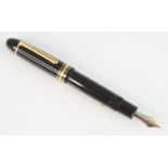 A cased Montblanc Meisterstück 149 fountain pen, black resin with gold-coated trim, the cap with