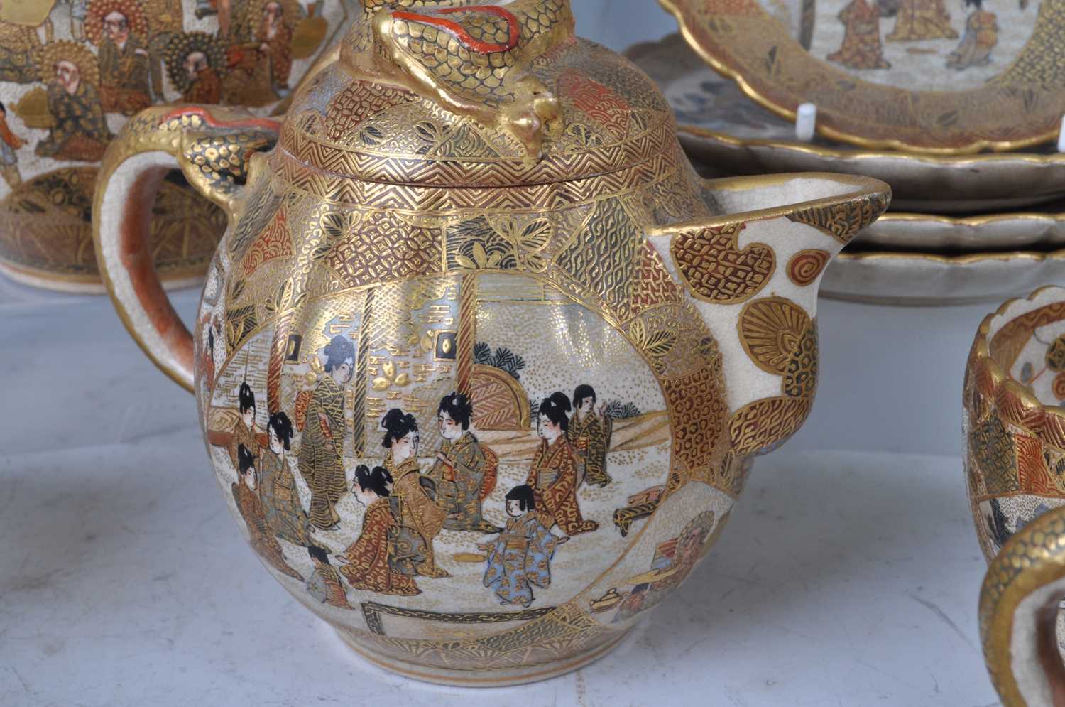 A Japanese satsuma six place tea set, early 20th century, comprising teapot and cover, cream jug and - Image 2 of 12