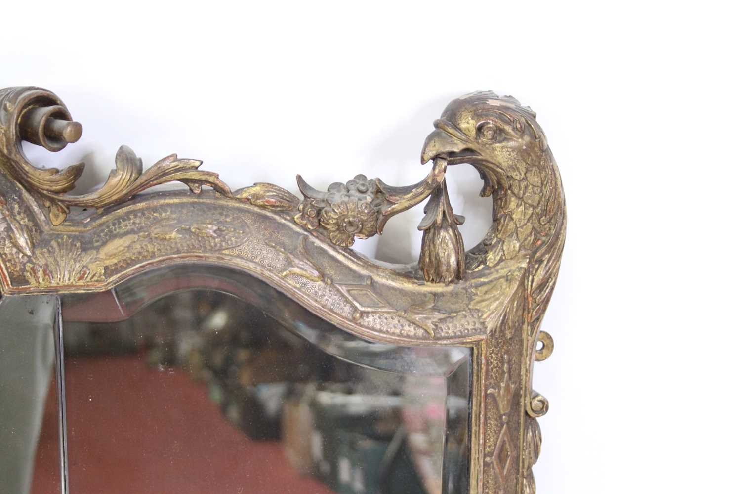 A 19th century giltwood and gesso overmantel mirror, having a triple shaped and bevelled mirrorplate - Image 4 of 4