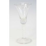 A wine glass, circa 1770, the bell bowl with solid base above an opaque twist stem and standing upon