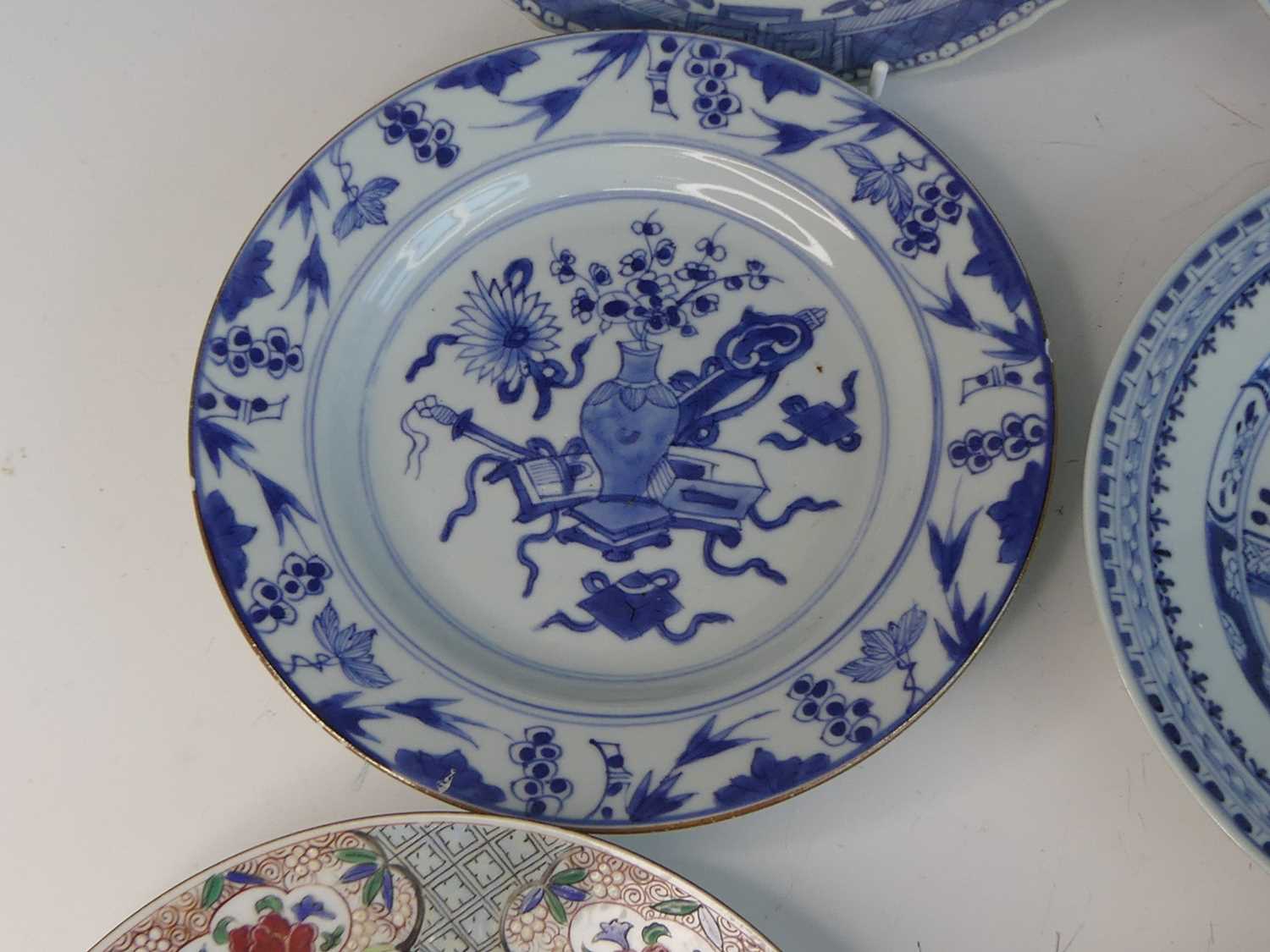 A collection of 18th century Chinese export porcelain plates and dishes, to include enamel decorated - Image 16 of 23