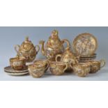 A Japanese satsuma six place tea set, early 20th century, comprising teapot and cover, cream jug and