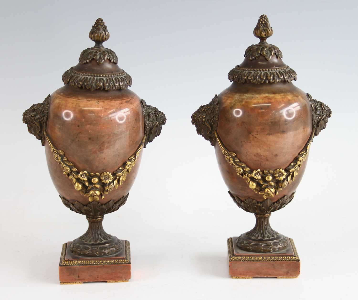 A pair of mid-19th century Jasper and gilt bronze mounted pedestal urns, having finial topped