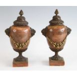 A pair of mid-19th century Jasper and gilt bronze mounted pedestal urns, having finial topped