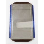 An Art Deco wall mirror, of stepped form, with rounded walnut graduated upper and lower detail and