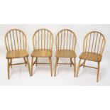 A matched set of four 1960s Ercol blond elm stickback kitchen chairs, each on turned slightly