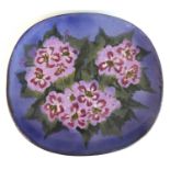 A large Chelsea studio pottery platter, underglaze floral painted in tones of purple and green,