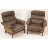 A pair of 1960s Danish chocolate brown leather, suede upholstered and hardwood framed armchairs,