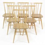 A set of six 1960s Ercol blond elm Model 391 stickback kitchen chairs, having slightly dished