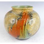 A mid-20th century Gouda pottery vase, of bulbous form, with volcanic bright coloured painted
