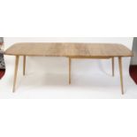 A 1960s Ercol light elm extending dining table, having rounded D-ends, pull-out action and single