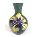 A mid-20th century Moorcroft miniature Hibiscus pattern pottery vase, of lower shouldered baluster