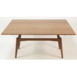 A 1960s Danish teak metamorphic coffee/dining table, having a rise-and-fall action, with opposing