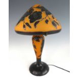 After Émile Gallé - a large cameo glass table lamp, the shade of mushroom form, with typical