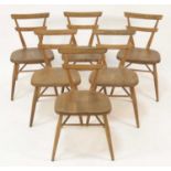 A set of six 1960s Ercol blond elm children's stacking chairs, each having twin curved bar backs and