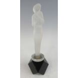 A 1930s frosted glass mascot, modelled as a standing stylised woman, raised on later faceted black
