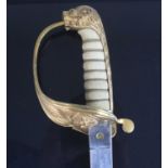 An 1827 pattern Indian Navy Officers sword, having a 79.5cm blade etched with a crowned star and