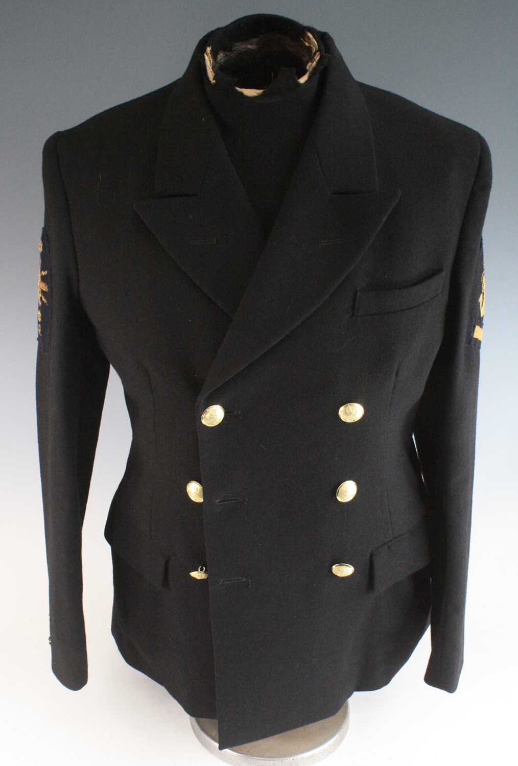 A British Royal Naval No.1 dress jacket for a Petty Officer with Good Conduct stripe and Weapons