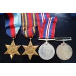 A collection of four WW II medals, to include 1939-1945 Star, Burma Star and War medal x2, in O.H.