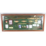A reproduction display of fishing items to include rod and gaff etc, 35 x 85cm, together with