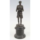 A bronze alloy figure of German Field Marshall Erwin Rommel, modelled in standing pose on titled