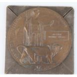 A WW I bronze memorial plaque, naming Arthur Edwin Hunt, with condolence slip in card envelope,