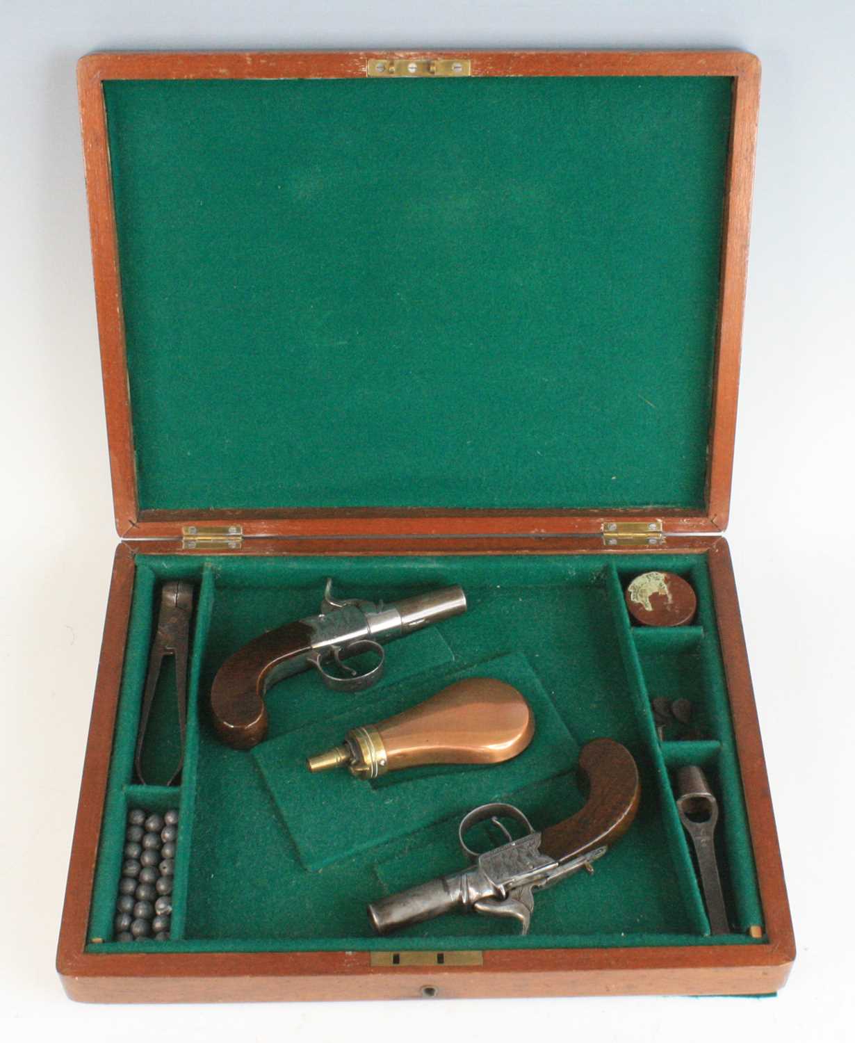 A pair of 19th century percussion box-lock pocket pistols, having 4cm turn-off steel barrels and