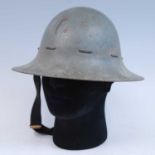 A WW II Zuckerman steel helmet, in grey finish with lace banding, the leather liner marked BMB (