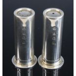 A pair of modern silver salt and peppers cruets, each in the form of a 12 bore shotgun cartridge,