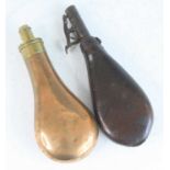 A 19th century copper powder flask, of typical pear shape, the brass nozzle measuring 2 - 2 1/2