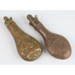 A Victorian copper powder flask, of typical form embossed with a stag and fox head with acorn and