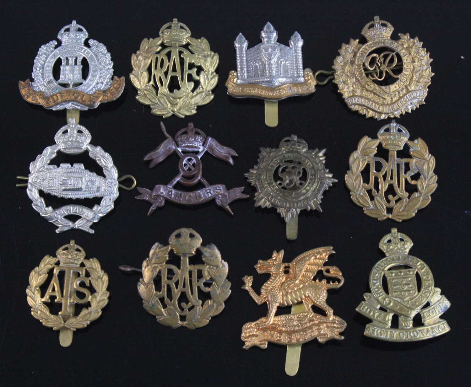 A collection of cap badges, to include Cambridgeshire Regiment, Suffolk Regiment. Westminster