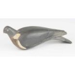 An early 20th century carved and painted pine decoy in the form of a pigeon, 36cm.