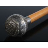 A George V swagger stick, having a malacca shaft and silver pommel with crest for the South