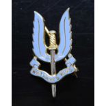 A Special Air Service 9ct gold and blue enamelled regimental brooch, in the form of the winged