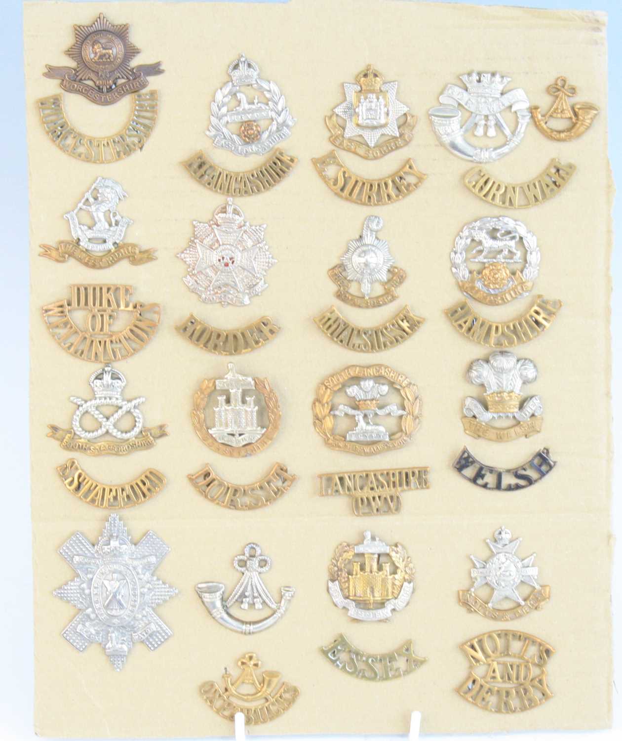 A collection of WW I British Artillery and Infantry cap badges and shoulder titles, to include The - Image 3 of 5