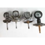 A collection of four various vintage radiator calormeters, two being chromed metal with stylised