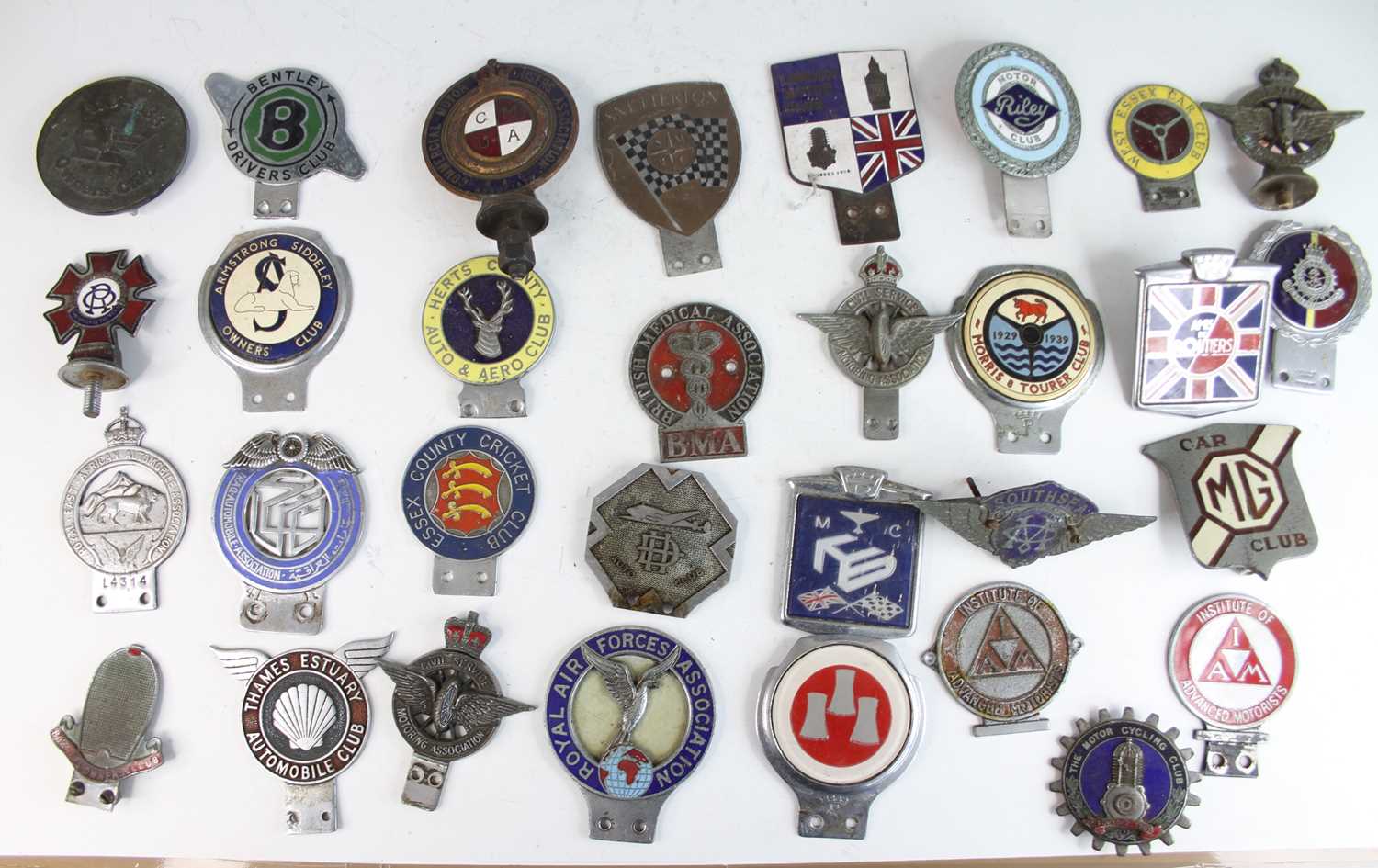 A large collection of vintage principally chromed metal car badges, some enamel decorated, to