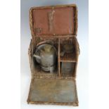 An early 20th century motorists wicker travel tea basket, with kettle and burner, tea infuser and