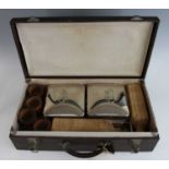 A vintage motorists travel picnic hamper, in leather effect hard case with fitted interior,